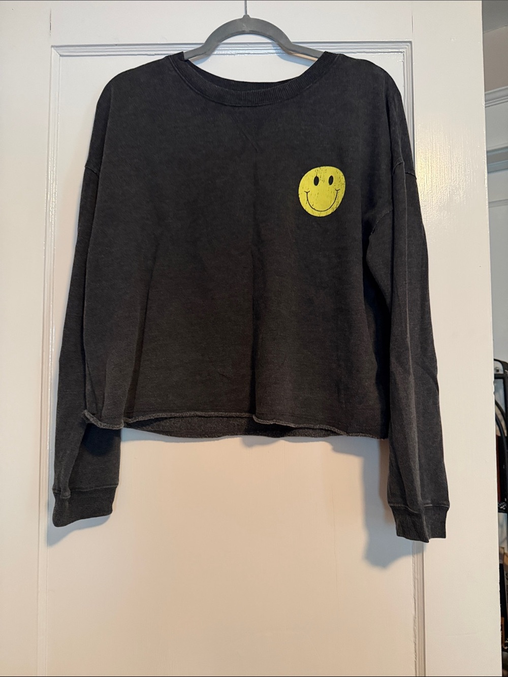 Black Cropped Sweatshirt with Yellow Smiley Graphic